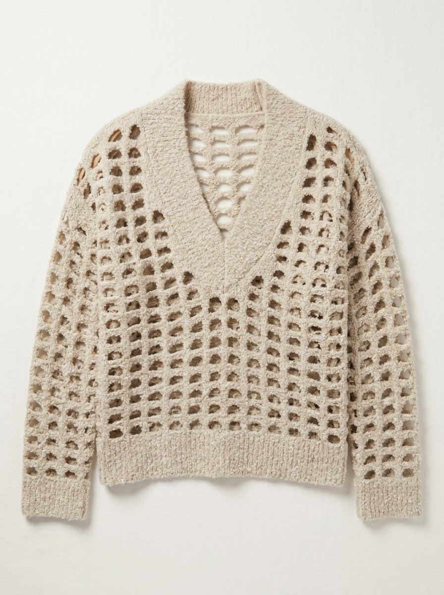 Close-up of the Meera stone V-neck jumper showing its open weave and ribbed collar