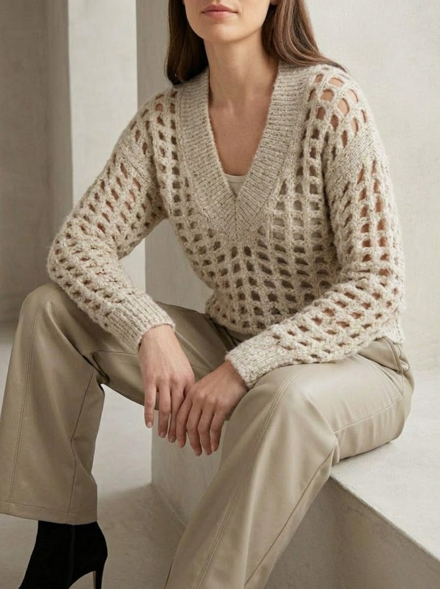 Model wearing the Meera stone V-neck jumper with Teri stone wide-leg pleather trousers