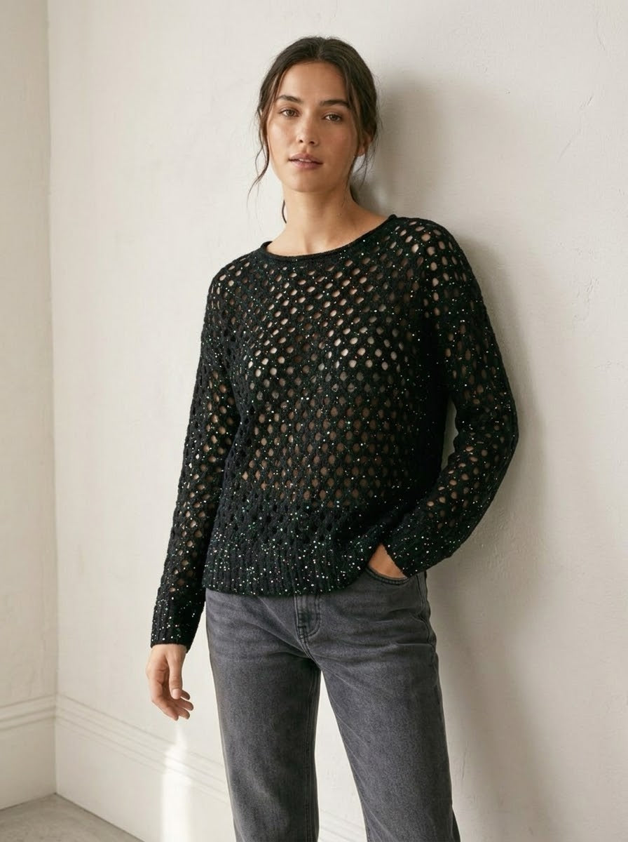 Model wearing the Barbados black slash-neck jumper with grey jeans